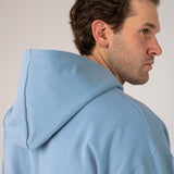 Closeup image of Ocean Meets Green men's golf hoodie Wave in ice