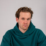Full body image of Ocean Meets Green men's golf hoodie Wave in pine
