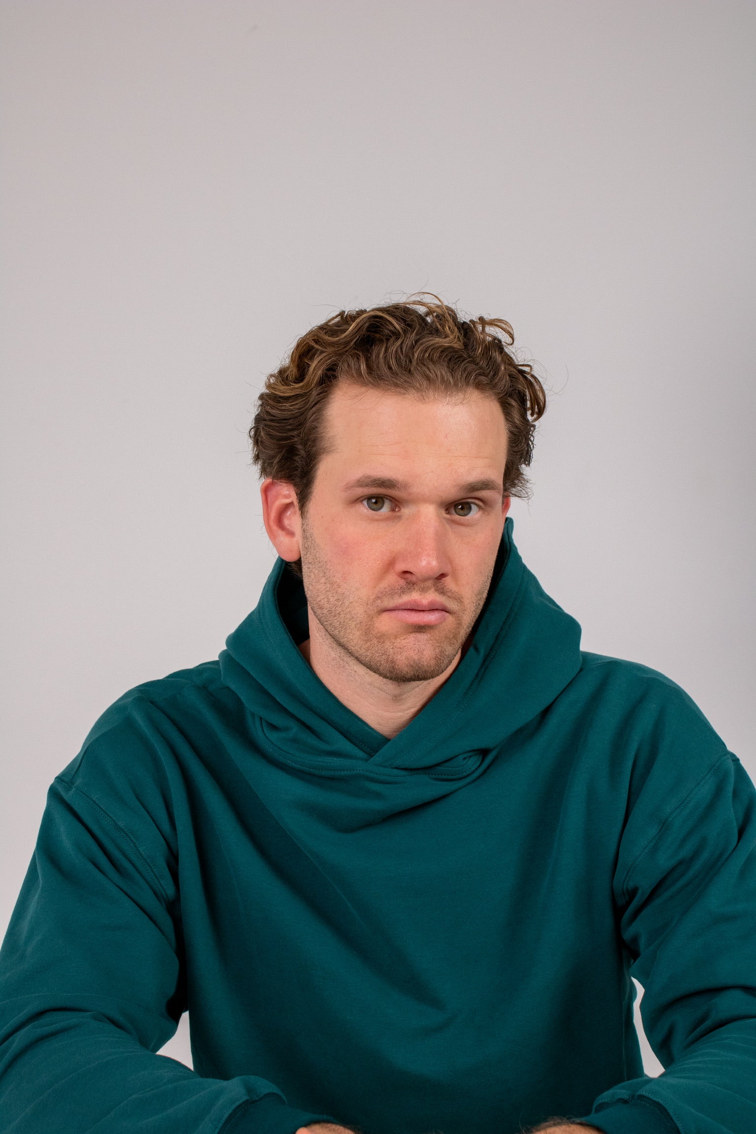 Full body image of Ocean Meets Green men's golf hoodie Wave in pine