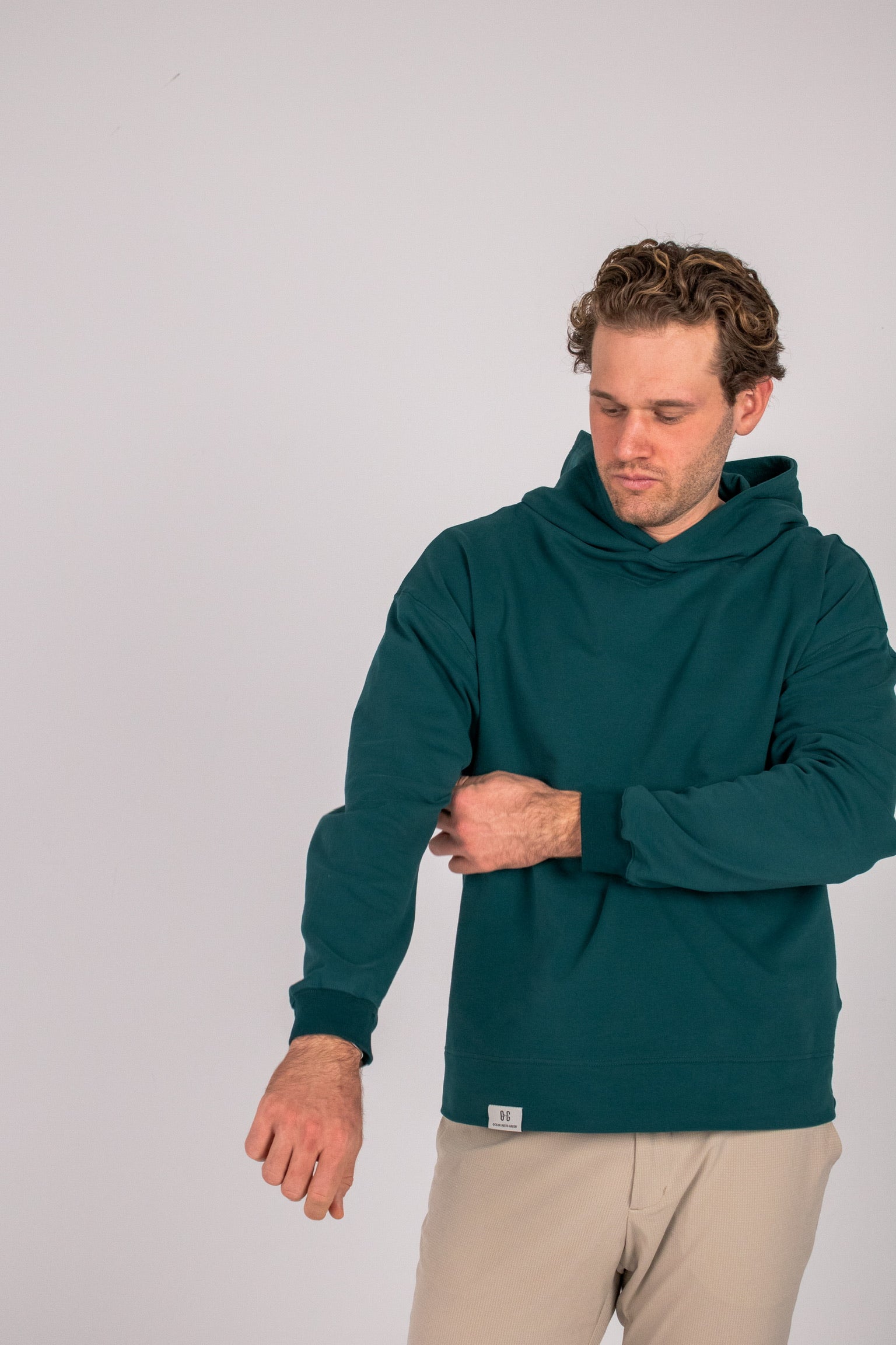 Full body image of Ocean Meets Green men's golf hoodie Wave in pine