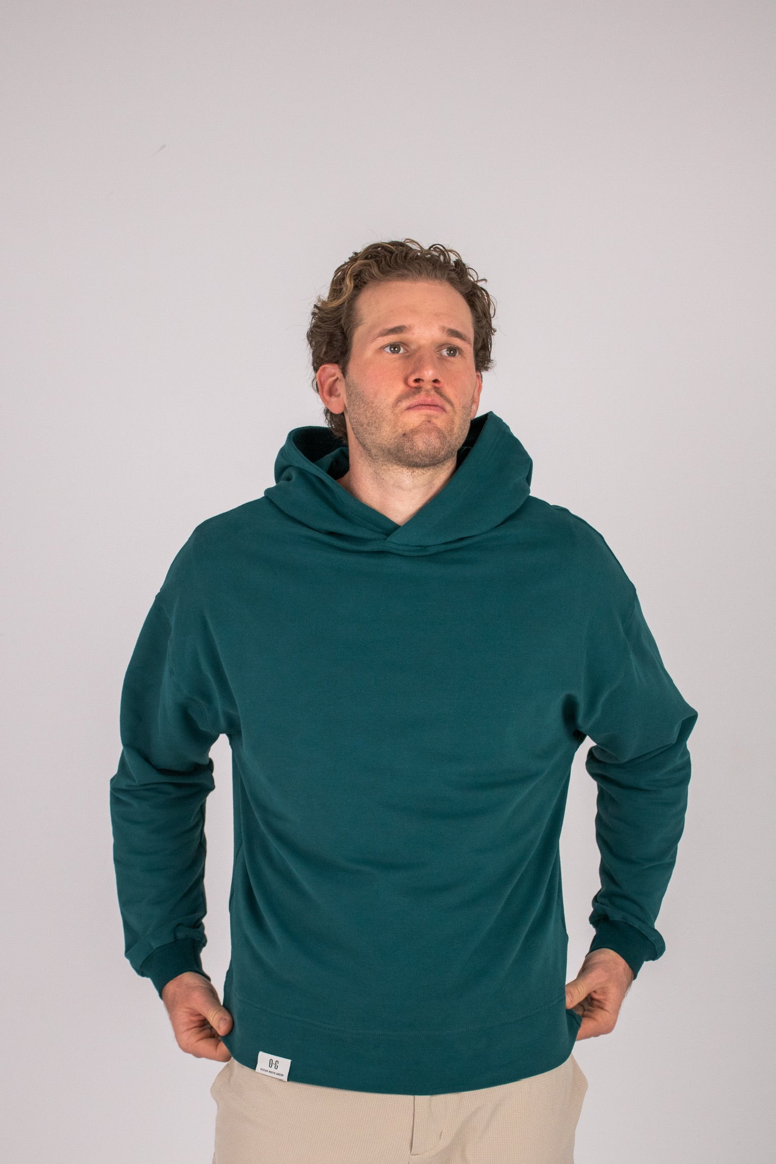 Full body image of Ocean Meets Green men's golf hoodie Wave in pine