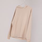 Image of Ocean Meets Green men's golf hoodie Wave in sand on a hanger