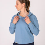 Fullbody image of Ocean Meets Green women's golf hoodie Flow in ice, showing the front opening