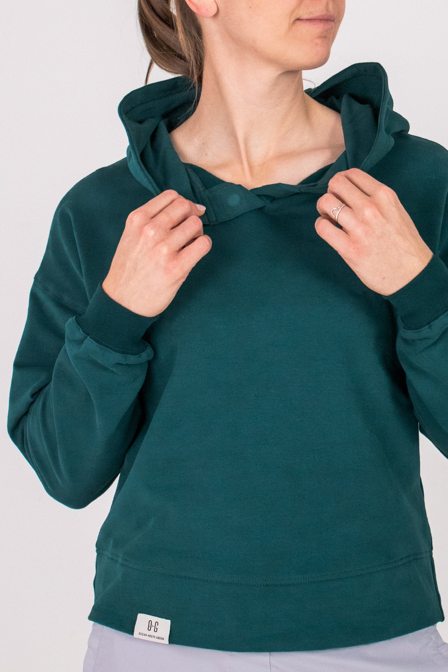 Fullbody image of Ocean Meets Green women's golf hoodie Flow in pine