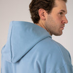 Closeup image of Ocean Meets Green men's golf hoodie Wave in ice