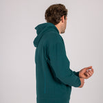 Full body image of Ocean Meets Green men's golf hoodie Wave in pine, showing the logo