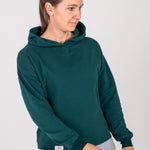 Fullbody image of Ocean Meets Green women's golf hoodie Flow in pine