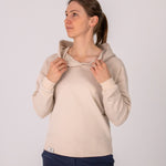 Fullbody image of Ocean Meets Green women's golf hoodie Flow in sand