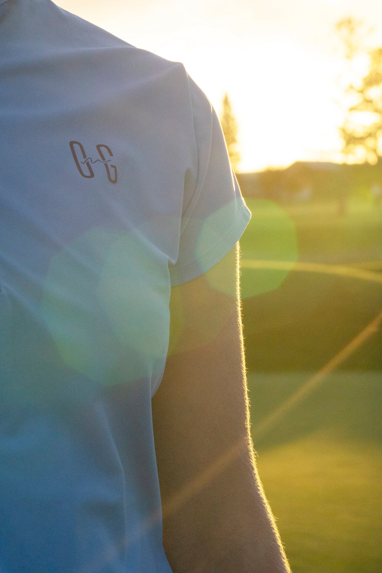 Image of Ocean Meets Green women's golf polo Moana in light blue with sunflare