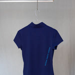 Image of Ocean Meets Green women's golf polo Moana in navy on a hanger back view