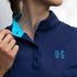 Image of Ocean Meets Green women's golf polo Moana in navy, showing the standup collar and front logo